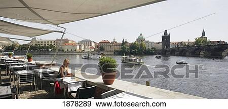 Woman Reading Menu In Cafe Near Charles Bridge View Large Photo Image Stock Photo - Woman Reading Menu In Cafe Near Charles Bridge. Fotosearch
