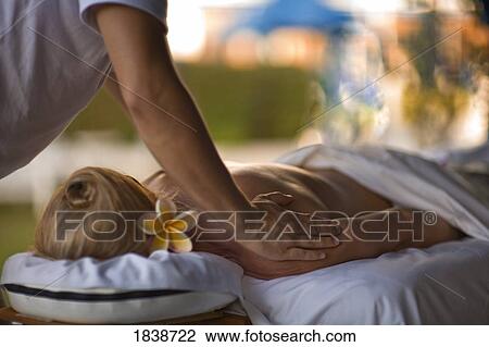 Stock Image - Woman Receiving Massage In Spa Resort; Fairmont Kea Lani, Outdoor Gazebo Spa, Wailea, Maui, Hawaii, Usa. Fotosearch