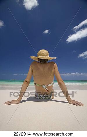 Woman relaxing on a beach; bahamas View Large Photo Image Picture - Woman relaxing on a beach; bahamas. Fotosearch