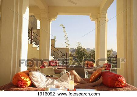 Woman Relaxing On Balcony View Large Photo Image Stock Image - Woman Relaxing On Balcony. Fotosearch