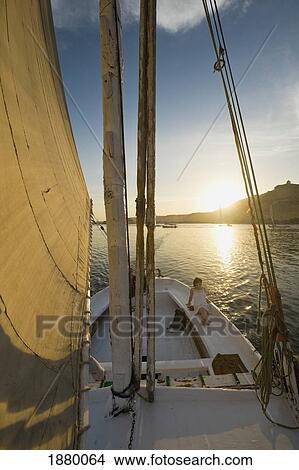 Woman Relaxing On Deck Of Felucca At Dusk View Large Photo Image Picture - Woman Relaxing On Deck Of Felucca At Dusk. Fotosearch