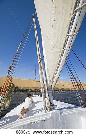 Woman Relaxing On Deck Of Felucca View Large Photo Image Stock Photography - Woman Relaxing On Deck Of Felucca. Fotosearch