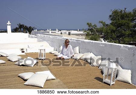 Woman Relaxing On Roof Terrace View Large Photo Image Stock Image - Woman Relaxing On Roof Terrace. Fotosearch