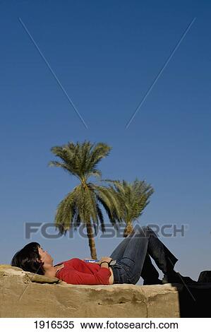 Woman Relaxing With Guidebook View Large Photo Image Stock Photography - Woman Relaxing With Guidebook. Fotosearch