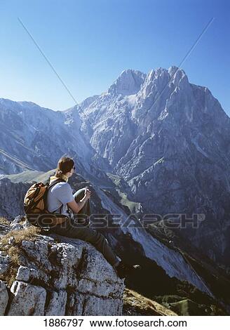 Woman Resting On Ridge In Front Of Corno Grande In The Campo Imperatore View Large Photo Image Stock Photo - Woman Resting On Ridge In Front Of Corno Grande In The Campo Imperatore. Fotosearch
