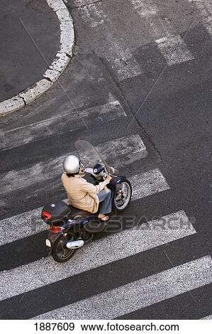 Woman Riding A Scooter, Aerial View View Large Photo Image Stock Photo - Woman Riding A Scooter, Aerial View. Fotosearch