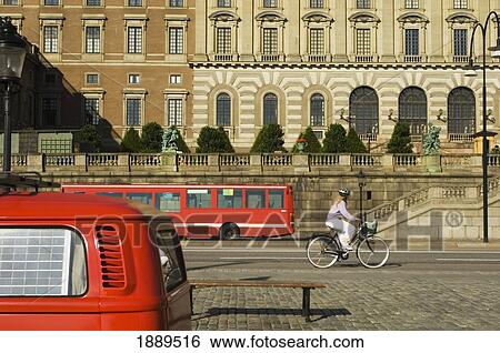 Stock Photograph - Woman Riding Past The Stockholm Palace.. Fotosearch
