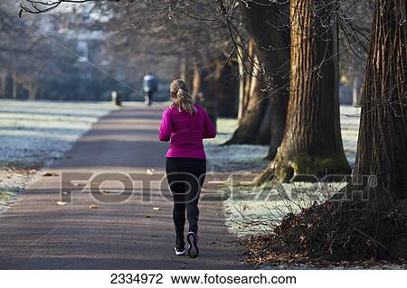 Woman Running In Greenwich Park On Frosty Winter Morning; Greenwich, London, England, Uk View Large Photo Image Stock Image - Woman Running In Greenwich Park On Frosty Winter Morning; Greenwich, London, England, Uk. Fotosearch