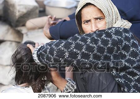 Woman Searching For Lice In A Girl's Head In A Relief Camp After The 8 October 2005 Earthquake, Muzaffarabad, Azad Kashmir, Pakistan View Large Photo Image Stock Photograph - Woman Searching For Lice In A Girl's Head In A Relief Camp After The 8 October 2005 Earthquake, Muzaffarabad, Azad Kashmir, Pakistan. Fotosearch