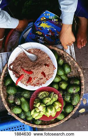Woman Selling Guava, Salt, And Chillies In A Market In Hanoi View Large Photo Image Stock Image - Woman Selling Guava, Salt, And Chillies In A Market In Hanoi. Fotosearch