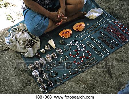 Stock Photo - Woman Selling Jewelry And Other Souvenirs, High Angle View. Fotosearch