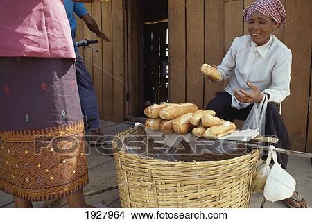 Picture - Woman Selling Local Produce. Fotosearch
