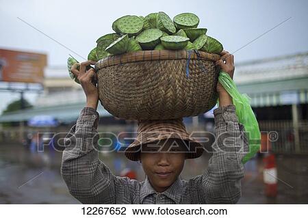 Woman selling lotus pods; Phnom Penh, Cambodia View Large Photo Image Stock Image - Woman selling lotus pods; Phnom Penh, Cambodia. Fotosearch