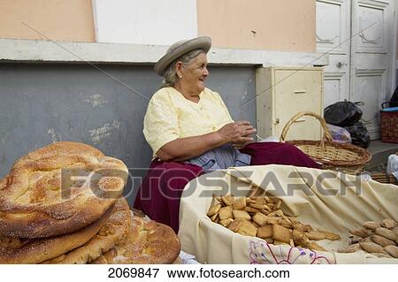 Stock Photo - Woman Selling Tortas De Comadres At The Jueves De Comadres Market During Carnaval Chapaco, Tarija, Bolivia. Fotosearch