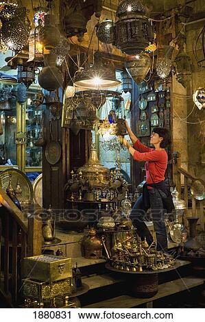 Stock Image - Woman Shopping At Market Stall In Khan El Khalili. Fotosearch