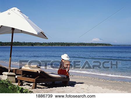 Woman Sitting Alone On Beach View Large Photo Image Stock Photo - Woman Sitting Alone On Beach. Fotosearch