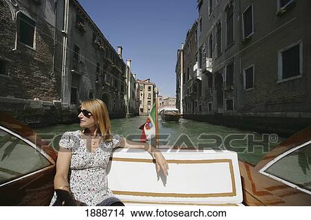 Woman Sitting On A Water Taxi, Venice View Large Photo Image Picture - Woman Sitting On A Water Taxi, Venice. Fotosearch