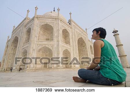 Woman Sitting On Ground Admiring The Taj Mahal At Dawn View Large Photo Image Stock Photo - Woman Sitting On Ground Admiring The Taj Mahal At Dawn. Fotosearch