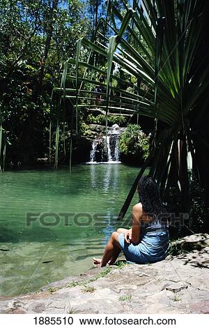 Woman Sitting On The Side Of A Natural Pool, Isalo National Park View Large Photo Image Stock Image - Woman Sitting On The Side Of A Natural Pool, Isalo National Park. Fotosearch
