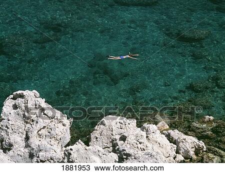 Woman Snorkeling In Anthony Quinn Bay View Large Photo Image Stock Image - Woman Snorkeling In Anthony Quinn Bay. Fotosearch