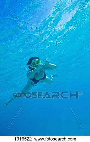 Stock Image - Woman Snorkeling In Red Sea. Fotosearch