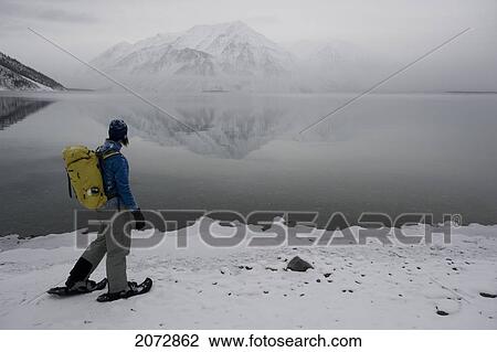 Woman Snowshoeing In Winter, Kathleen Lake, Kluane National Park, Yukon, Canada View Large Photo Image Stock Image - Woman Snowshoeing In Winter, Kathleen Lake, Kluane National Park, Yukon, Canada. Fotosearch
