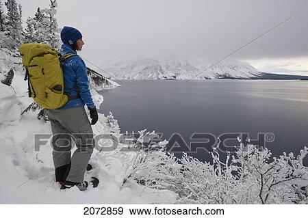 Woman Snowshoeing In Winter, Kathleen Lake, Kluane National Park, Yukon, Canada View Large Photo Image Stock Photo - Woman Snowshoeing In Winter, Kathleen Lake, Kluane National Park, Yukon, Canada. Fotosearch