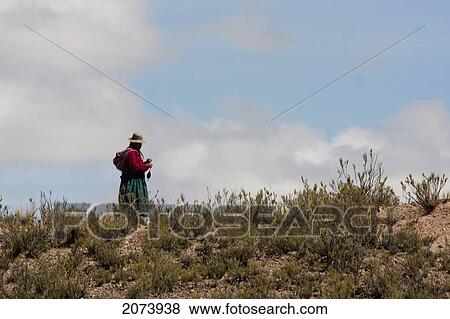Stock Photo - Woman Spindling Wool, Pumiri, Oruro, Bolivia. Fotosearch