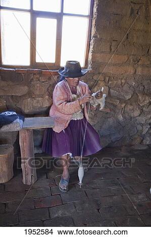 Woman spinning wool, Jatun Yampara Indigenous Community, Chuquisaca Department, Bolivia View Large Photo Image Picture - Woman spinning wool, Jatun Yampara Indigenous Community, Chuquisaca Department, Bolivia. Fotosearch