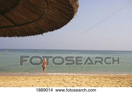 Woman Standing In Water On Beach View Large Photo Image Picture - Woman Standing In Water On Beach. Fotosearch