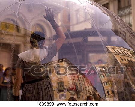 Woman Standing Inside Transparent Glass Globe And Crowd Watching Her Performance; Rome, Italy View Large Photo Image Stock Photo - Woman Standing Inside Transparent Glass Globe And Crowd Watching Her Performance; Rome, Italy. Fotosearch