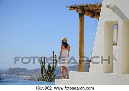 Woman Standing On Terrace, Cabo San Lucas, Mexico View Large Photo Image Stock Image - Woman Standing On Terrace, Cabo San Lucas, Mexico. Fotosearch