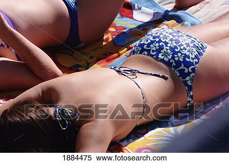 Stock Photography - Woman Sunbathing, Close Up. Fotosearch