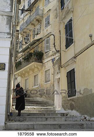 Stock Photo - Woman Sweeping Steps. Fotosearch