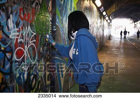 Woman Tagger At Leake Street, Graffiti Tunnel; Lambeth, London, England, Uk View Large Photo Image Picture - Woman Tagger At Leake Street, Graffiti Tunnel; Lambeth, London, England, Uk. Fotosearch