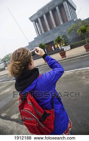 Woman Taking Photograph Of Ho Chi Minh Mauseleum, Rear View, Ho Chi Minh City, Vietnam View Large Photo Image Stock Photo - Woman Taking Photograph Of Ho Chi Minh Mauseleum, Rear View, Ho Chi Minh City, Vietnam. Fotosearch
