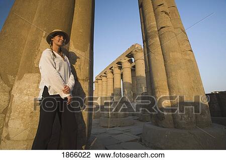 Stock Image - Woman Tourist At The Temple Of Luxor, Luxor, Nile Valley, Egypt. Fotosearch