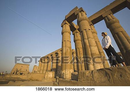 Stock Photo - Woman Tourist At The Temple Of Luxor, Luxor, Nile Valley; Luxor, Nile Valley, Egypt. Fotosearch