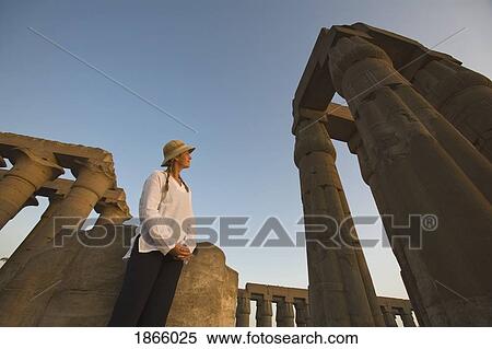Stock Photography - Woman Tourist At The Temple Of Luxor, Egypt. Fotosearch