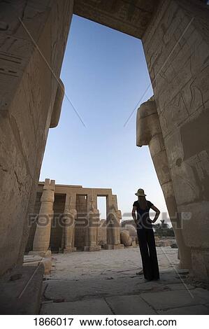 Woman Tourist Gazes At The Ramesseum, Luxor, Nile Valley, Egypt View Large Photo Image Stock Photo - Woman Tourist Gazes At The Ramesseum, Luxor, Nile Valley, Egypt. Fotosearch