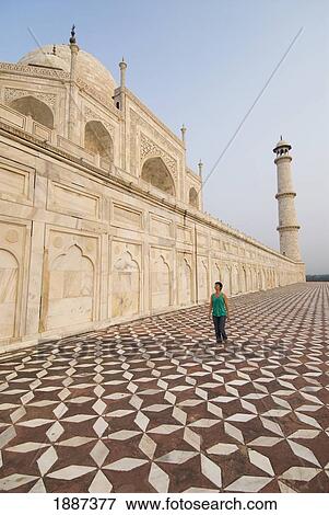 Woman Walking Beneath The Taj Mahal On Tiled Ground View Large Photo Image Stock Photo - Woman Walking Beneath The Taj Mahal On Tiled Ground. Fotosearch