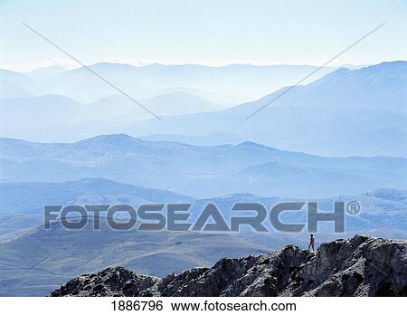 Woman Walking Down Ridge In The Campo Imperatore View Large Photo Image Stock Photograph - Woman Walking Down Ridge In The Campo Imperatore. Fotosearch
