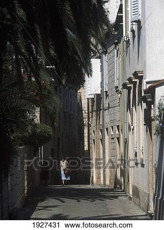 Woman Walking Narrow Alley Between The Village Of Kut And Vis Town View Large Photo Image Stock Image - Woman Walking Narrow Alley Between The Village Of Kut And Vis Town. Fotosearch
