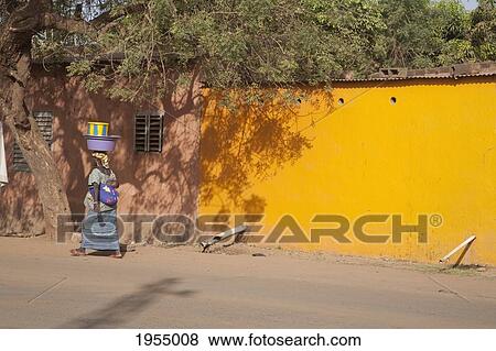 Woman walking on street, Bamako, Mali View Large Photo Image Stock Photo - Woman walking on street, Bamako, Mali. Fotosearch