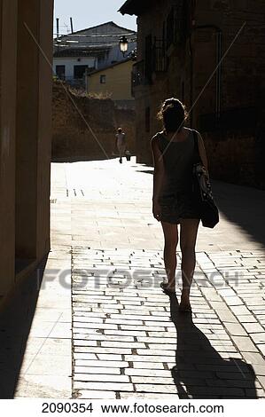 Picture - Woman Walking On The Streets Of Elciego, Basque Country, Spain. Fotosearch