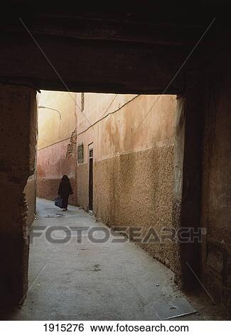 Woman Walking Through Backstreets View Large Photo Image Stock Photograph - Woman Walking Through Backstreets. Fotosearch