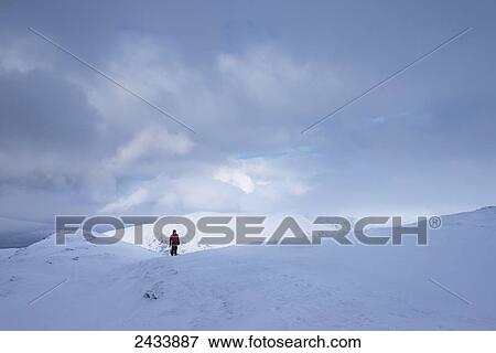 Woman walking up Beinn Dorain in snowy, winter conditions, near Bridge of Orchy; Argyll and Bute, Scotland View Large Photo Image Stock Photo - Woman walking up Beinn Dorain in snowy, winter conditions, near Bridge of Orchy; Argyll and Bute, Scotland. Fotosearch