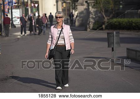 Woman Walking Up La Rambla, Barcelona, Spain View Large Photo Image Stock Photo - Woman Walking Up La Rambla, Barcelona, Spain. Fotosearch