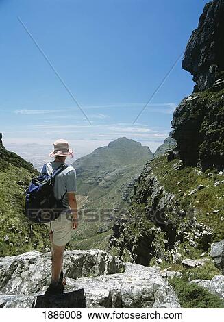 Stock Photo - Woman Walking Up The Platteklip Gorge To The Top Of Table Mountain. Fotosearch