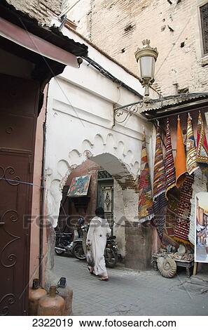 Woman walking with shopping bag; Medina, Marrakech, Morocco View Large Photo Image Stock Photo - Woman walking with shopping bag; Medina, Marrakech, Morocco. Fotosearch